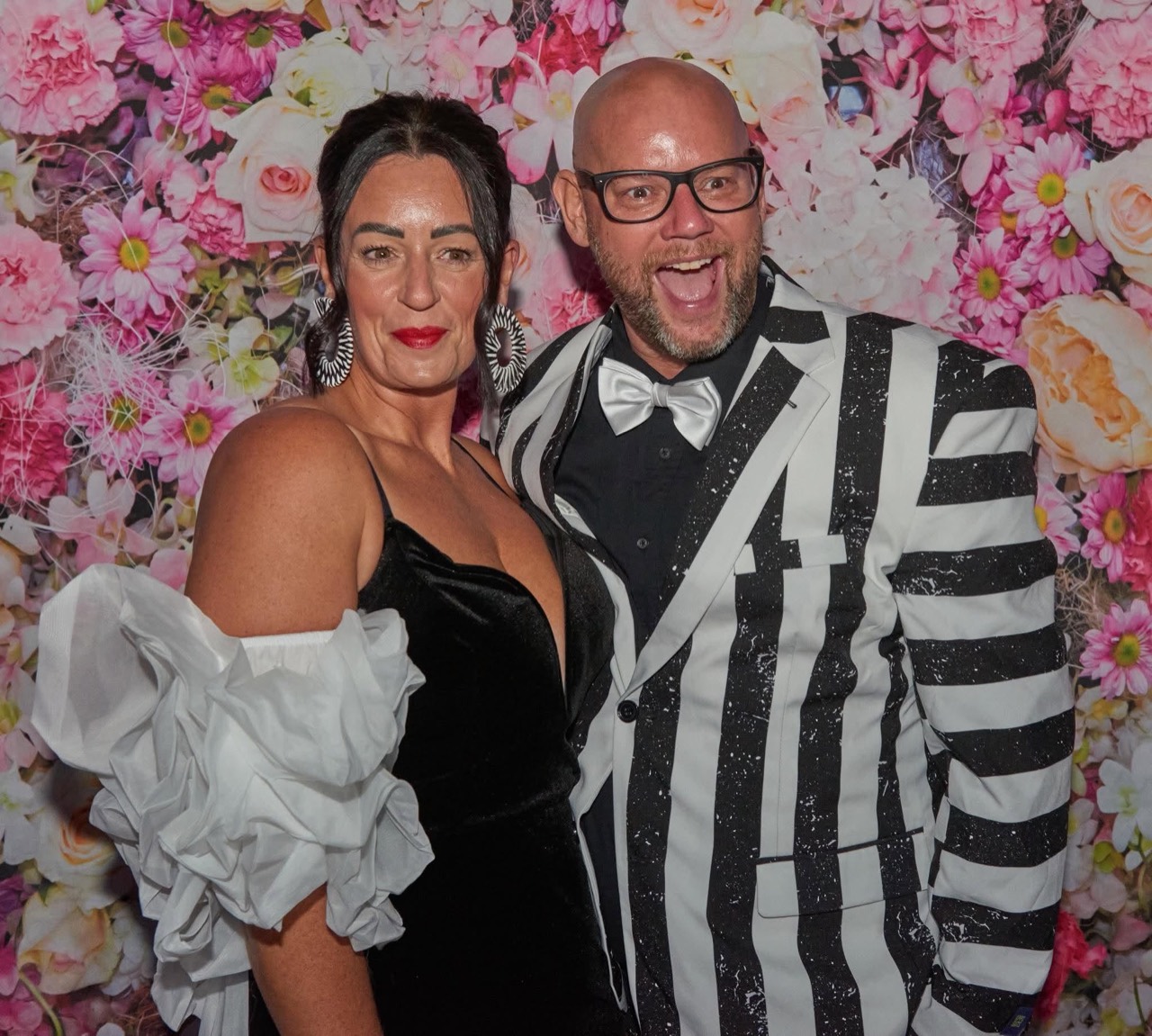 A couple dressed in formalwear at the Parent Prom photo booth